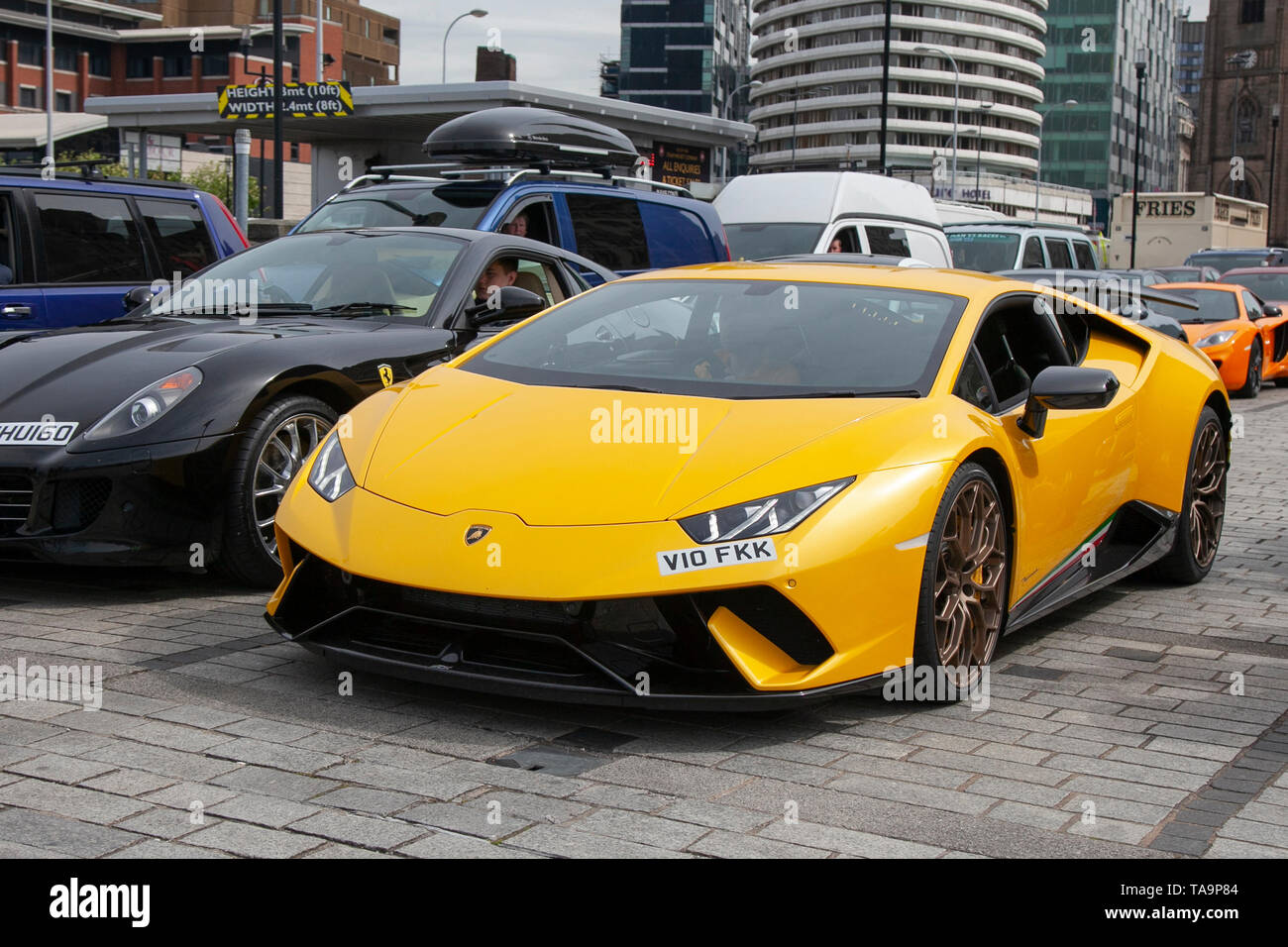 Liverpool, Merseyside. 23rd May, 2019 UK Weather: Fine, sunny sailing condition as up to 200 motorcyclists and tens of supercars including a Lamborghini Huracan Performante Lp640, queue to board the ferry to the Isle of Man to attend the island TT races.  Extra ferry services are to be added to cope with the large demand for spectators travelling to attend this year’s top motor sport week of qualifying events of the fastest road race on the planet. Credit: MediaWorldImages/AlamyLiveNews Stock Photo