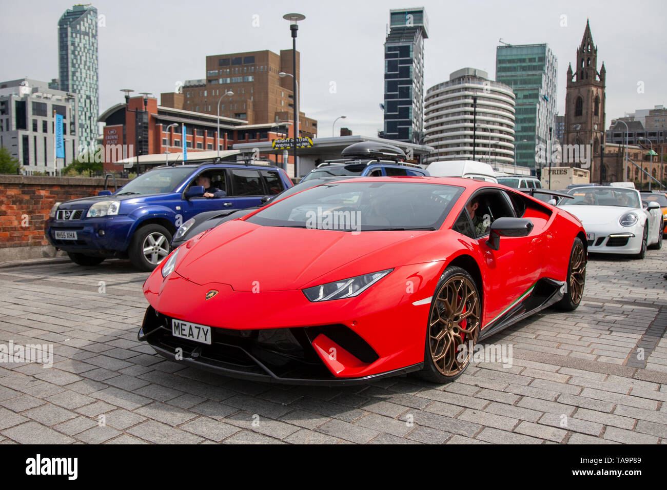 Liverpool, Merseyside. 23rd May, 2019 UK Weather: Fine, sunny sailing condition as up to 200 motorcyclists and tens of supercars including a 2018 Lamborghini Huracan LP 610-4 S-A, queue to board the ferry to the Isle of Man to attend the island TT races.  Extra ferry services are to be added to cope with the large demand for spectators travelling to attend this year’s top motor sport week of qualifying events of the fastest road race on the planet. Credit: MediaWorldImages/AlamyLiveNews Stock Photo