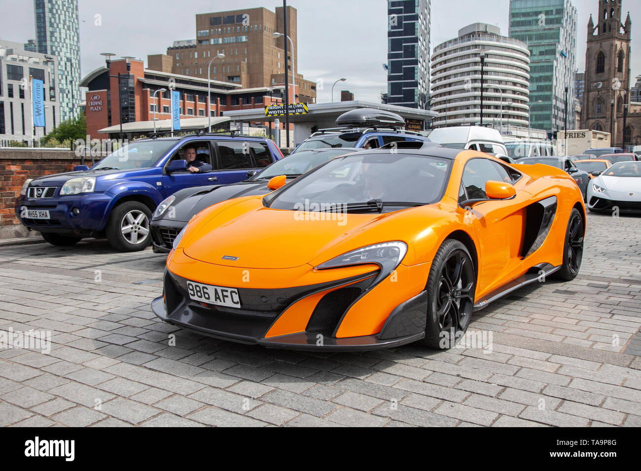 Liverpool, Merseyside. 23rd May, 2019 UK Weather: Fine, sunny sailing condition as up to 200 motorcyclists and tens of supercars including a Mclaren 675LT Coupe S-A, queue to board the ferry to the Isle of Man to attend the island TT races.  Extra ferry services are to be added to cope with the large demand for spectators travelling to attend this year’s top motor sport week of qualifying events of the fastest road race on the planet. Credit: MediaWorldImages/AlamyLiveNews Stock Photo