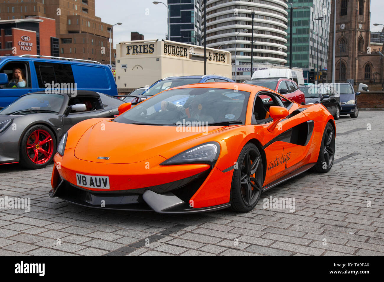 Liverpool, Merseyside. 23rd May, 2019 UK Weather: Fine, sunny sailing condition as up to 200 motorcyclists and tens of supercars including a Mclaren 570S Coupe S-A queue to board the ferry to the Isle of Man to attend the island TT races.  Extra ferry services are to be added to cope with the large demand for spectators travelling to attend this year’s top motor sport week of qualifying events of the fastest road race on the planet. Credit: MediaWorldImages/AlamyLiveNews Stock Photo