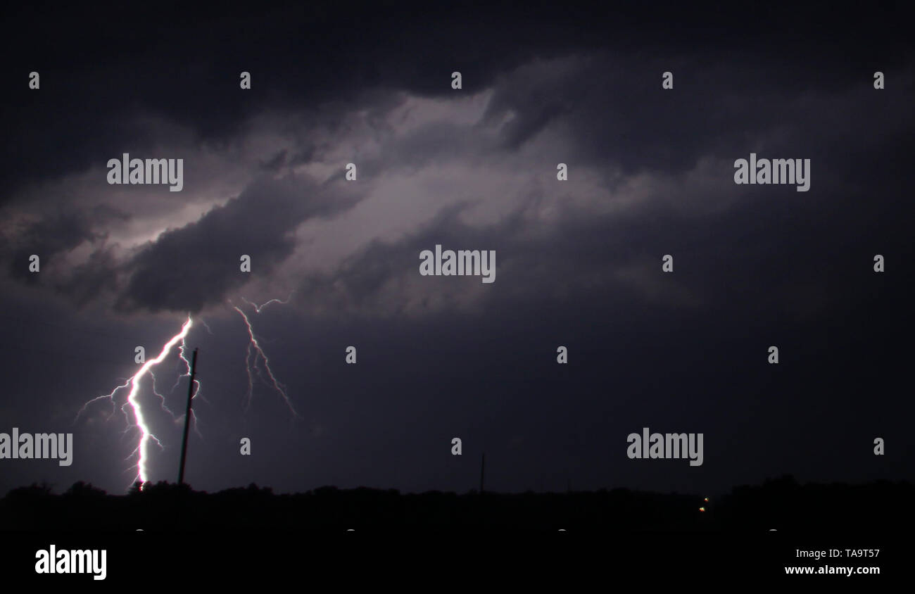 Lightning strikes from late evening tornado warn vortex cells cross