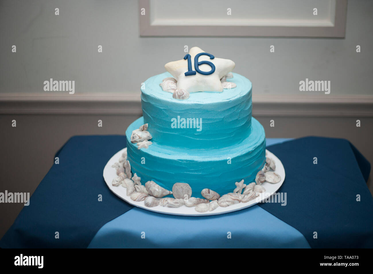 Sweet 16 Double-Tiered Birthday Cake with Light Blue Frosting Stock Photo