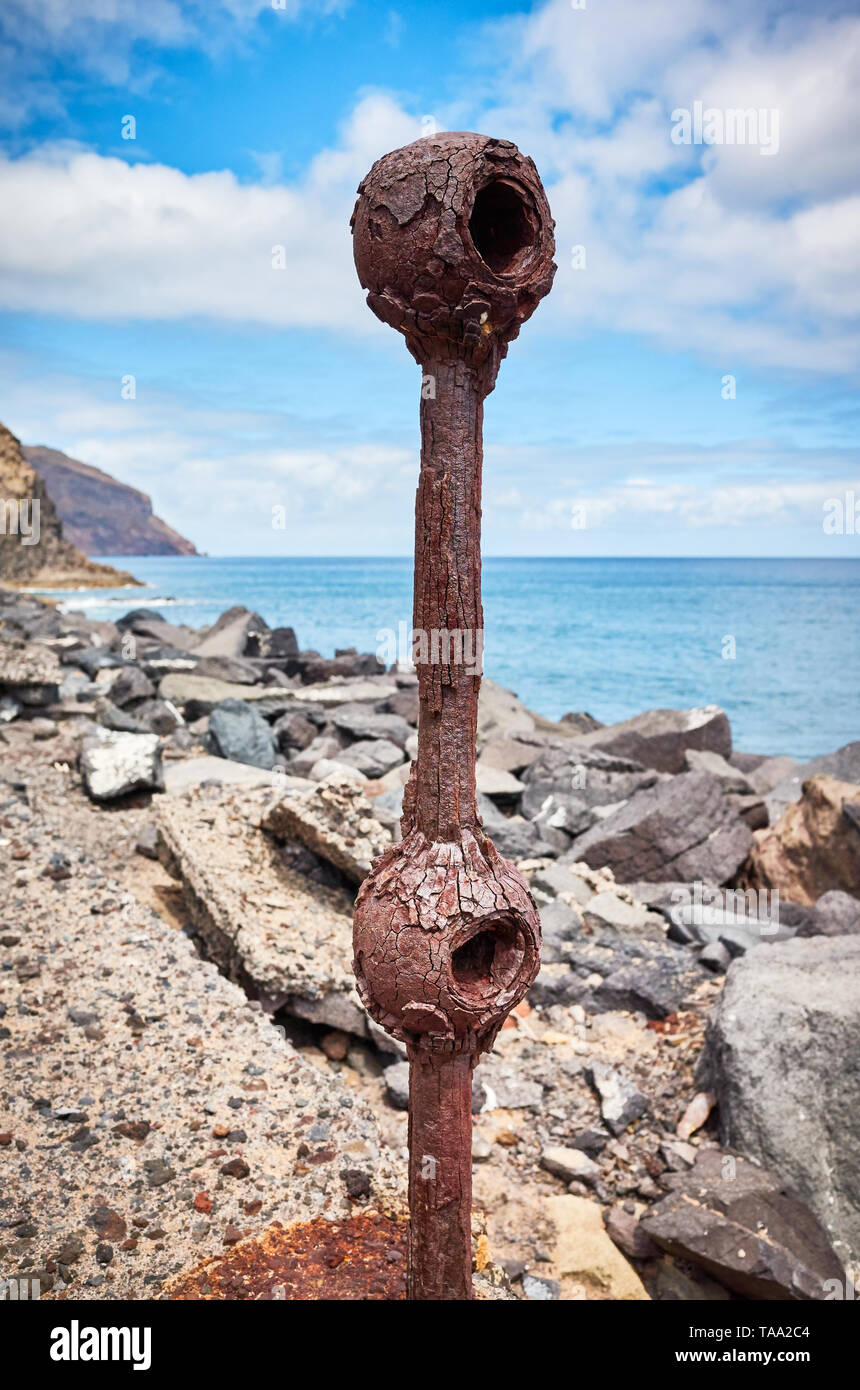 Old rusted piece of guard rail on a quay at Beach De Las Teresitas in San Andres, selective focus, Tenerife, Spain. Stock Photo