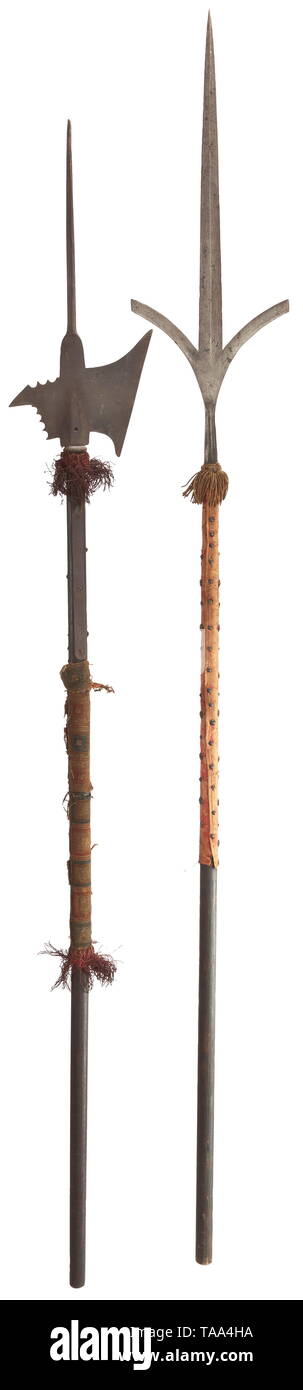 A halberd and a corseca, late 17th and early 16th century respectively The halberd head with central spike of diamond section flattened at the base, axe blade with oblique straight edge, flat rear fluke indented along its upper and lower rear edges. The base pierced for a transverse bolt (missing), and extending to a pair of straps. On later wooden haft with old textile tassel and grip covering. Length of head 53,5 cm. The corseca formed with a long sharply tapering central blade flanked at the base by a pair of flat outwardly-curved blades, and , Additional-Rights-Clearance-Info-Not-Available Stock Photo