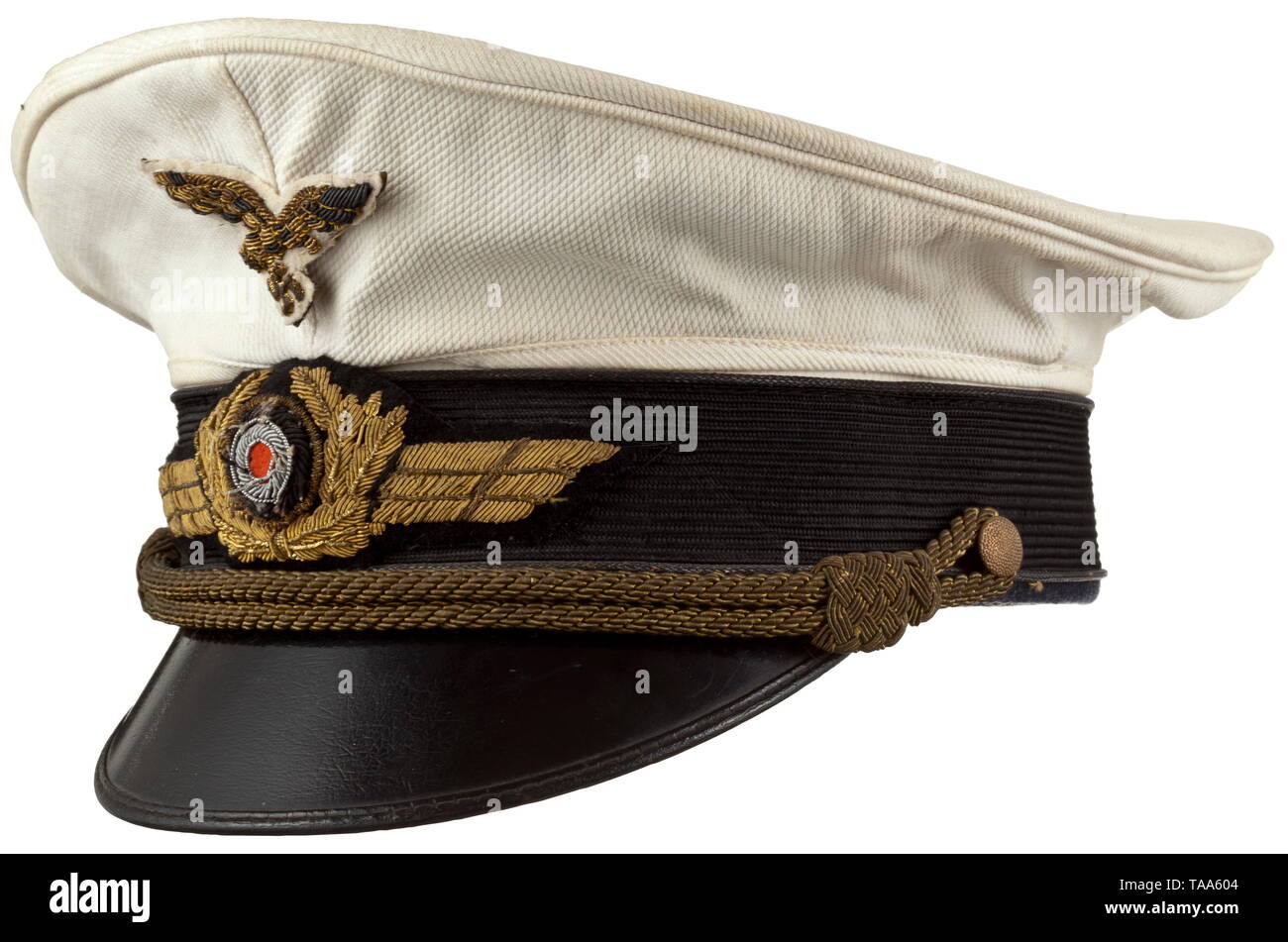 A summer visor cap for generals Removable cover of white waffled pique with pinned, gold embroidered eagle on a white base. Black mohair trim band, gold piping (toned), gold embroidered wings, gold cap cording. White silk liner, cap trapezoid with logo stamped in silver 'Erel Sonderklasse Extra' and 'Verkaufsabteilung der Luftwaffe Berlin'. Light-brown leather sweatband (light damage), on the inside a silver stamping 'Erel Stirnschutz D.R.G.M.'. Signs of usage and age. historic, historical, Air Force, branch of service, branches of service, armed service, armed services, mi, Editorial-Use-Only Stock Photo