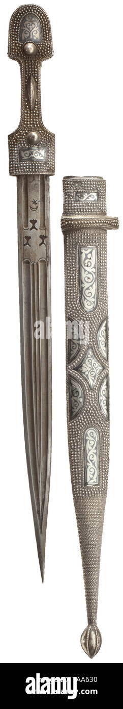 A Caucasian silver-mounted kinjal, circa 1900 Double-edged blade, both sides with multiple grooves and with smith's marks at the base. Grip and scabbard in silver with ornamental niello work, the entire obverse surface with a beaded band decor. Length 57.5 cm. historic, historical, Ottoman, Orient, Oriental, Asia, Asian, 20th century, Additional-Rights-Clearance-Info-Not-Available Stock Photo