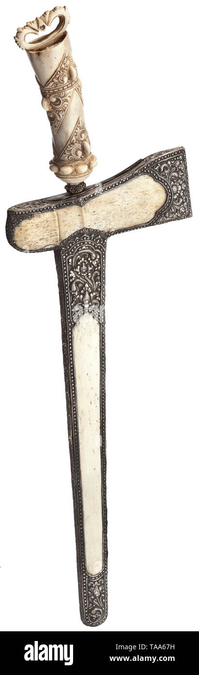 A Sumatran silver fitted kris, 20th century Straight, heavily ridged blade on both sides with a carved base and superb black-white pamor. Stone-studded mendhak with lavishly carved, tapering bone grip. Warangka and scabbard of bone with finely chased floral silver mounting on both sides. Length 62 cm. historic, historical, Indonesian archipelago, Indonesia, Far East, Asia, Asian, ethnology, ethnicity, ethnic, tribal, object, objects, stills, clipping, clippings, cut out, cut-out, cut-outs, Additional-Rights-Clearance-Info-Not-Available Stock Photo