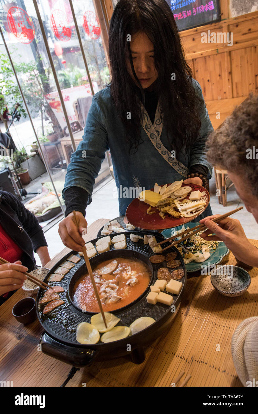 Hot Pot Restaurant in Chengdu, Sichuan, China. The food is cooked in a