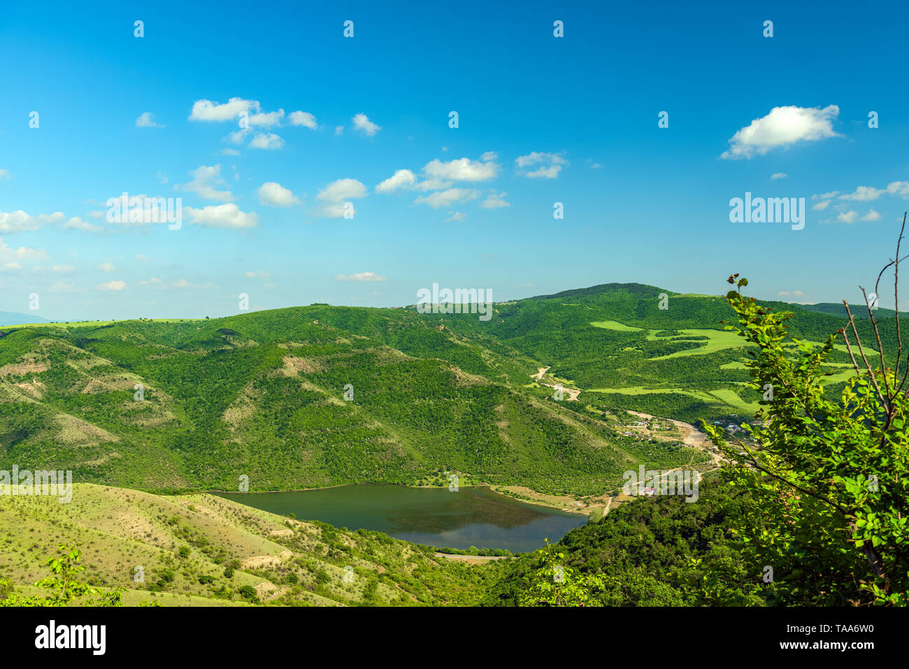 Landscape of mountains covered with green forest and blue sky with ...