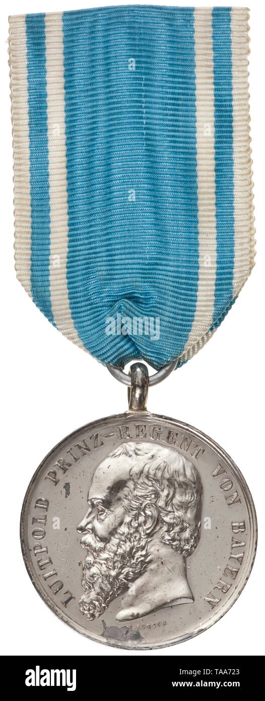 A long service award for 40 years for civilian employees in army administration A medal minted in silver by the medal maker to the court Alois Börsch with fully legible signature 'A. BÖRSCH' stamped on the obverse at the ribbon. The medal is in mint original condition and, like the King Ludwig Cross in Silver (both chambers), has been covered in protective varnish by the manufacturer to prevent the high-grade silver from oxidising. From its foundation in 1898 until it was no longer awarded at the end of 1919, a mere 161 copies were produced in th, Additional-Rights-Clearance-Info-Not-Available Stock Photo