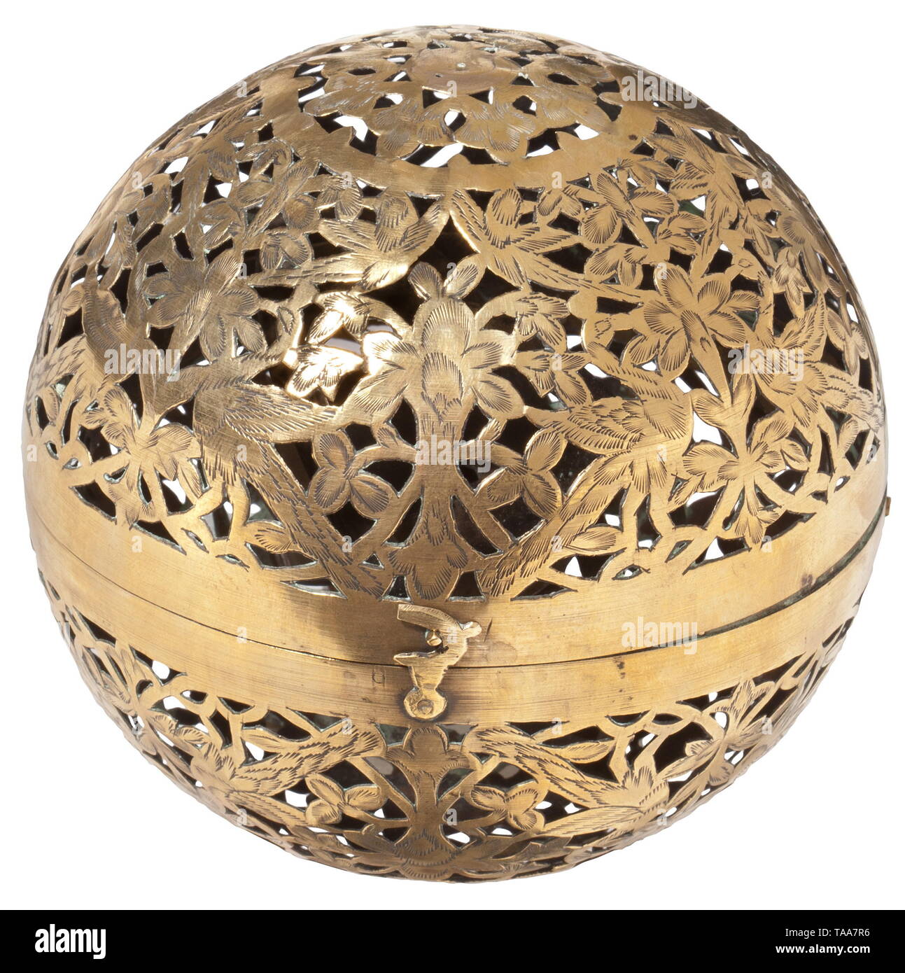 A spherical hand warmer, Nuremberg, 17th century Globe made up of two openworked hemispheres of sheet brass, the two hinged halves fastened with a hook. The front richly engraved with decorative tendrils and birds. A small oil lamp inside the globe with quadruple gimballed mounting. Small repair on one hemisphere. Diameter 13 cm. Rare hand warmer, which was used during the long winters. The gimballed mounting allows the globe to be rotated freely without changing the direction of the lamp. historic, historical, handicrafts, handcraft, craft, obje, Additional-Rights-Clearance-Info-Not-Available Stock Photo