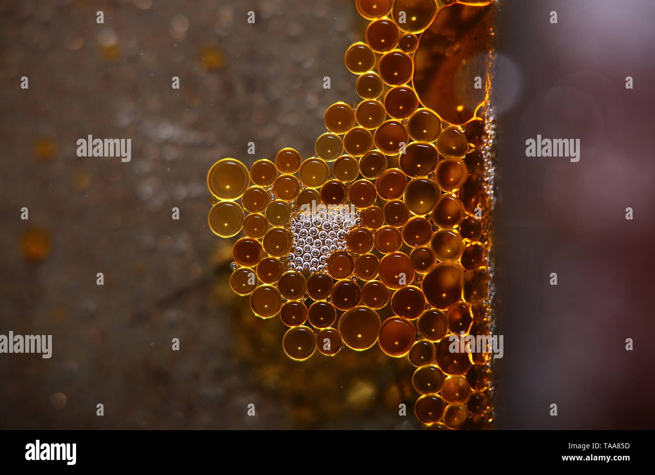 Drops of grease in a regular pattern. Stock Photo