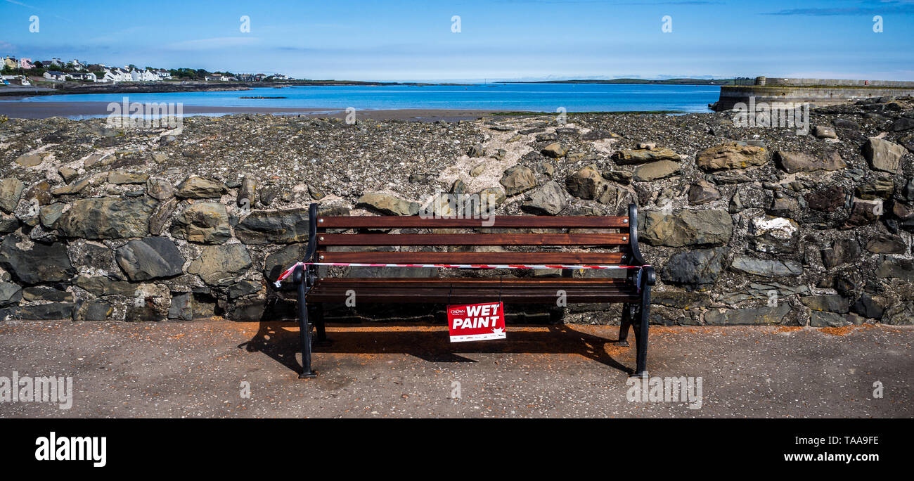 WET PAINT - bench on seafront at Donaghadee Stock Photo