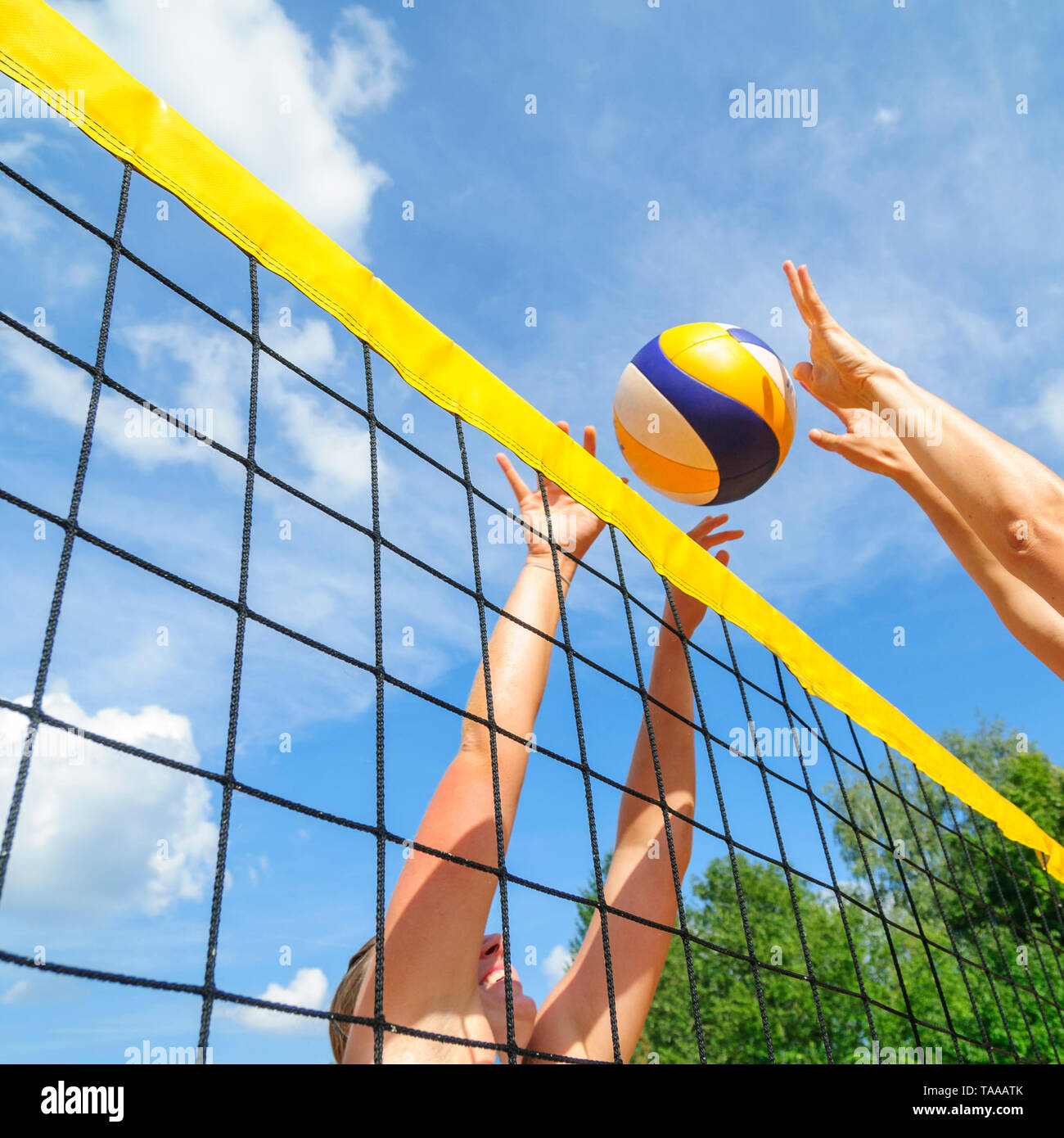 Competitive game on beachvolleyball court at the net Stock Photo Alamy
