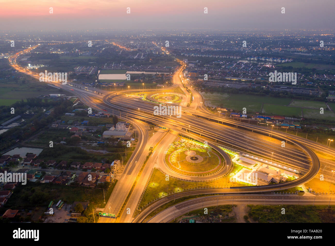 Aerial view of highway junctions. Bridge roads shape number 8 or infinity sign in structure of architecture concept. Top view. Urban city, Bangkok at  Stock Photo