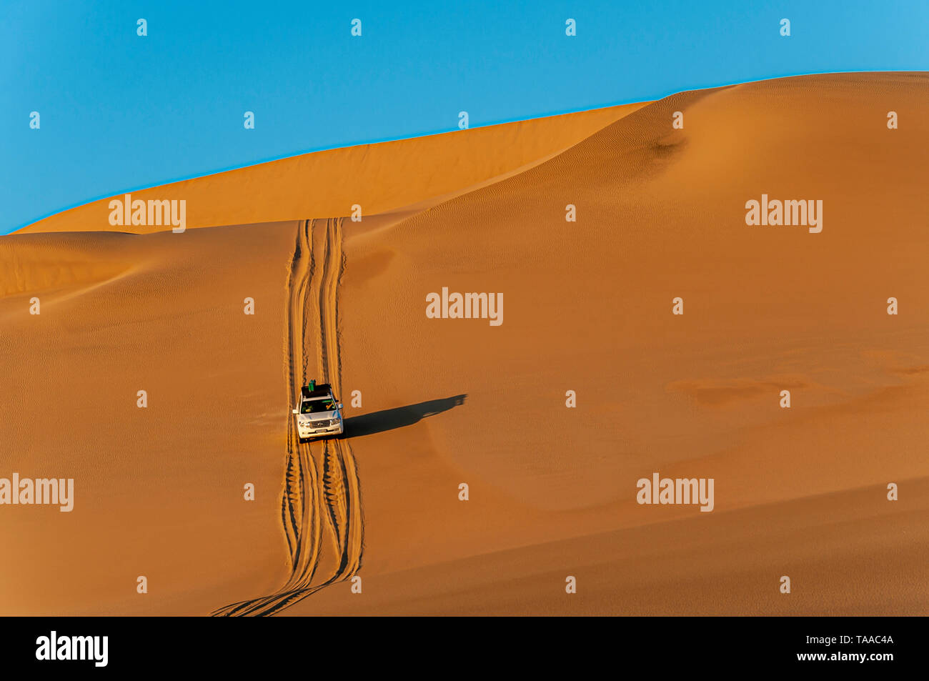 One fourwheel drive vehicle follows a track through the Namib desert of Namibia Stock Photo Alamy