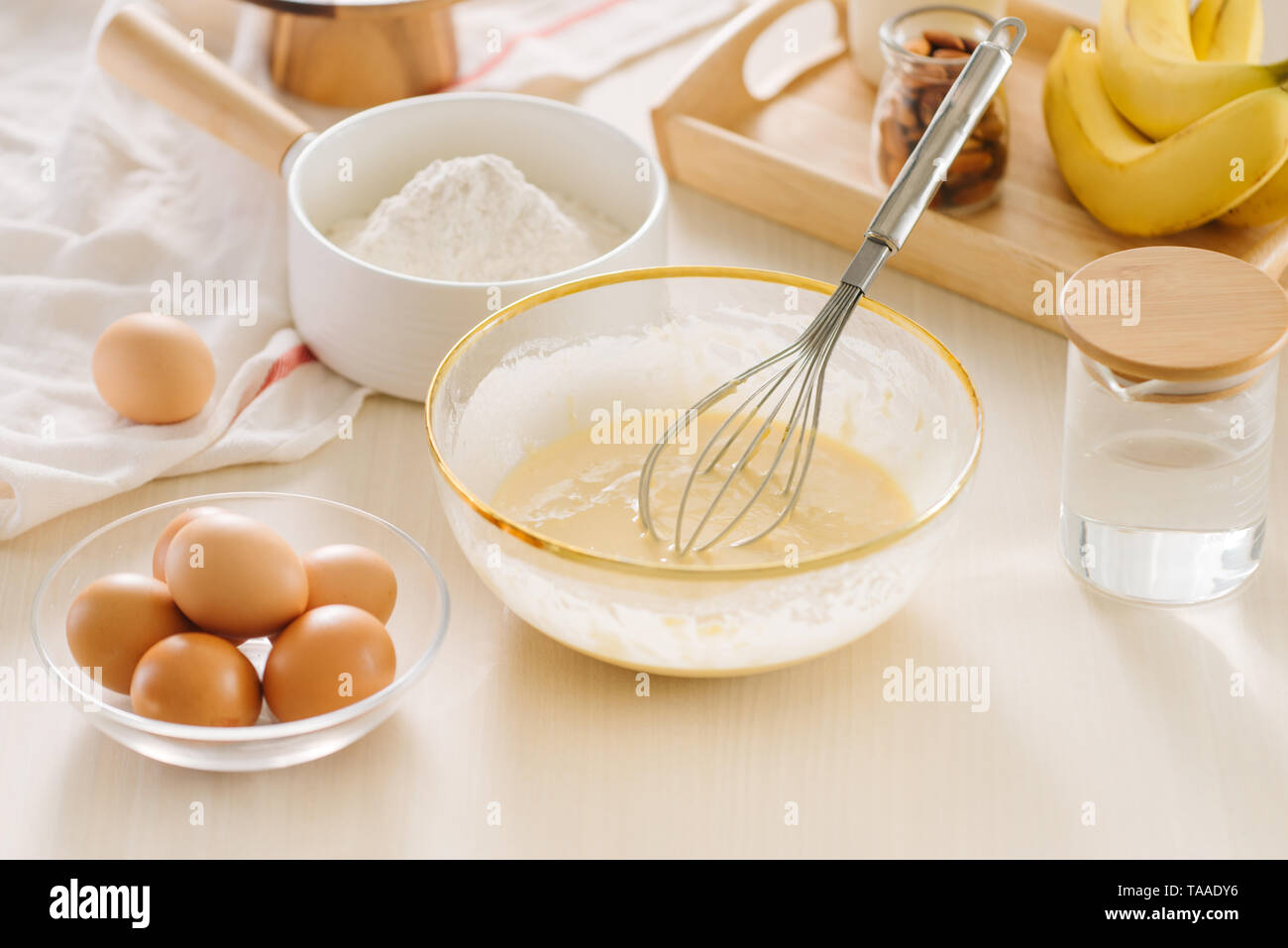 Ingredients and tools for baking sweet cake with banana and almonds Stock Photo