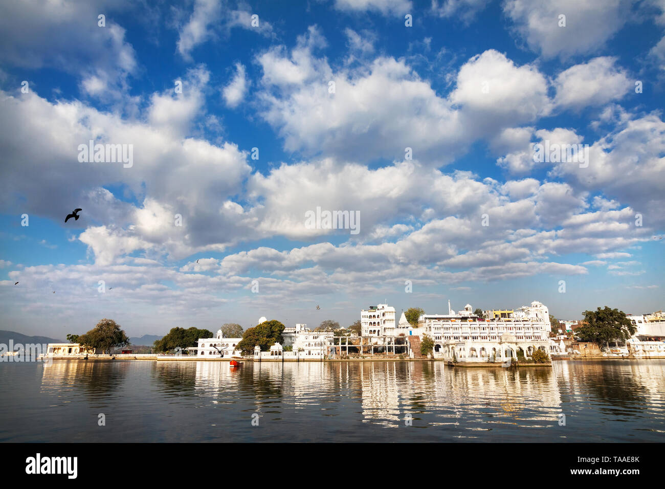 Lake Pichola with City Palace view at cloudy sky in Udaipur, Rajasthan, India Stock Photo