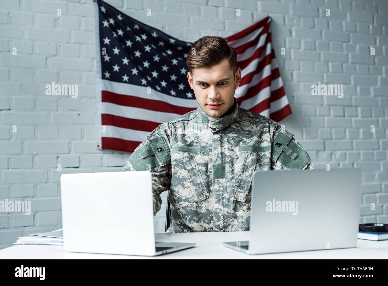 handsome man in military uniform using laptops in office Stock Photo ...