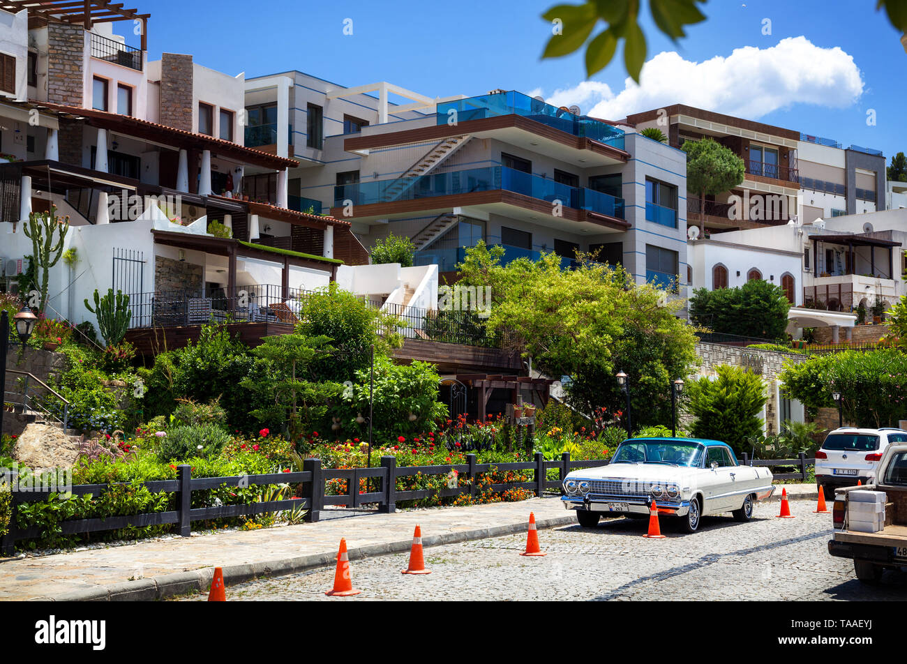 BODRUM, TURKEY - MAY 25, 2016: Vintage luxury white car standing in front of the hotel entrance Stock Photo