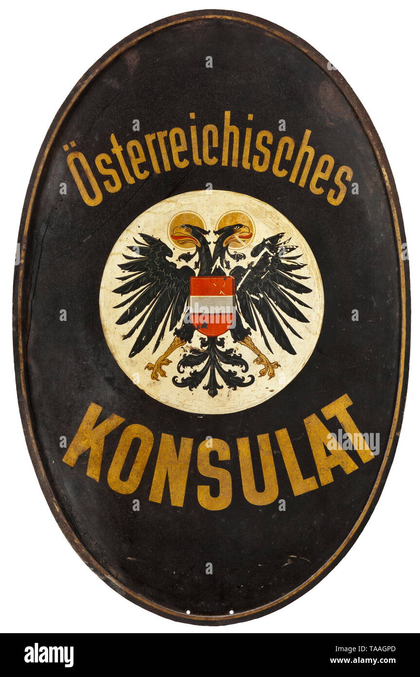 A sign of the Austrian Consulate Iron coated with lacquer and enamel painting, respectively. In the centre coat of arms, double-headed eagle and national colours, circumscription 'Österreichisches Konsulat', decorative wreath riveted on the side, attachment mount on the reverse. Dimensions 100 x 64 cm. historic, historical, 20th century, Additional-Rights-Clearance-Info-Not-Available Stock Photo