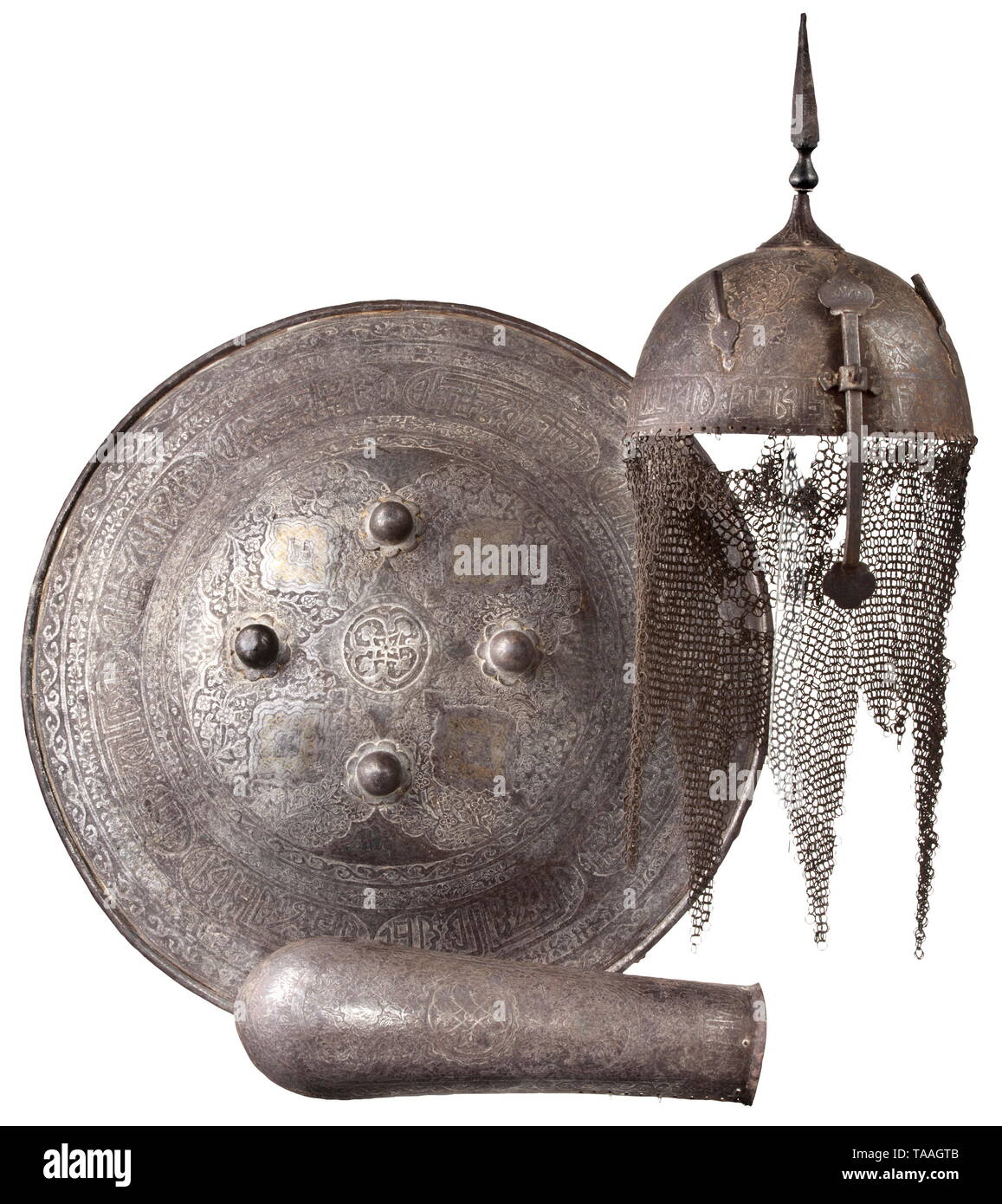 A Persian round shield, helmet and arm guard, 19th century Domed iron shield with riveted reinforcement around the edge. The obverse profusely etched with flowers damascened in brass and silver. Four screw-mounted bosses with fastening rings at loops and original (detached) lining at back. Diameter 46.5 cm. One-piece hammered skull profusely etched with ornaments and figures and damascened in (darkened) silver. Screw-mounted quadrangular spike with adjustable nasal bar, plume holder on both sides. Attached aventail of butted iron rings (larger lo, Additional-Rights-Clearance-Info-Not-Available Stock Photo