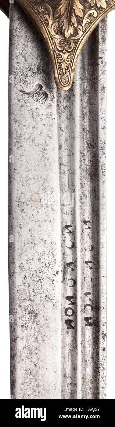 A superb silver-mounted sabre for a Hungarian magnate, circa 1870/80 Old, slightly curved, single-edged blade dating from the 17th century, with a broad, double-edged point. Double fullers on both sides, the root with a pseudo inscription and a Turkish mark (tughra?) stamped into one side. The quillons with relief décor in richly engraved and chased gilt silver, one arm cracked and stabilised. On the front, the head of a Magyar prince in half relief. Grip panels of dark horn with finely engraved grip bands, the pommel cap with an integrated, deli, Additional-Rights-Clearance-Info-Not-Available Stock Photo