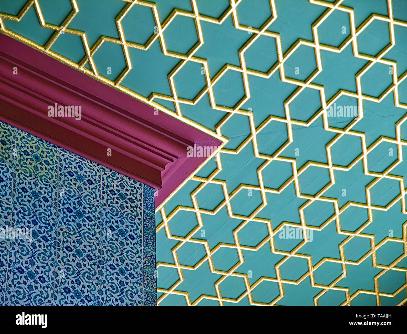 View of classical oriental design, calligraphy pattern art on walls and golden star shaped pattern on roof at Topkapi Palace of istanbul. Stock Photo