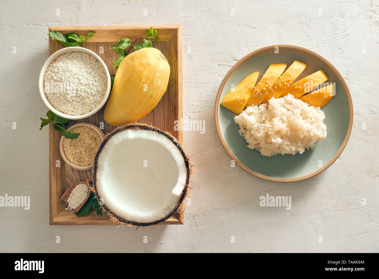 Thai Dessert - Mango Rice Sticky with mango, coconut, rice, semame on tray Stock Photo