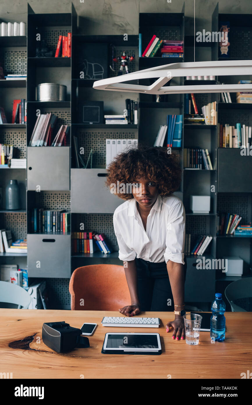 young african businesswoman working in coworking office and looking ...