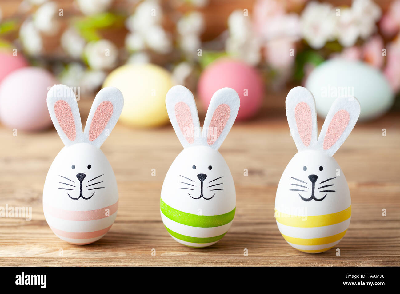 Happy easter background with easter bunny, easter eggs and flowers Stock Photo