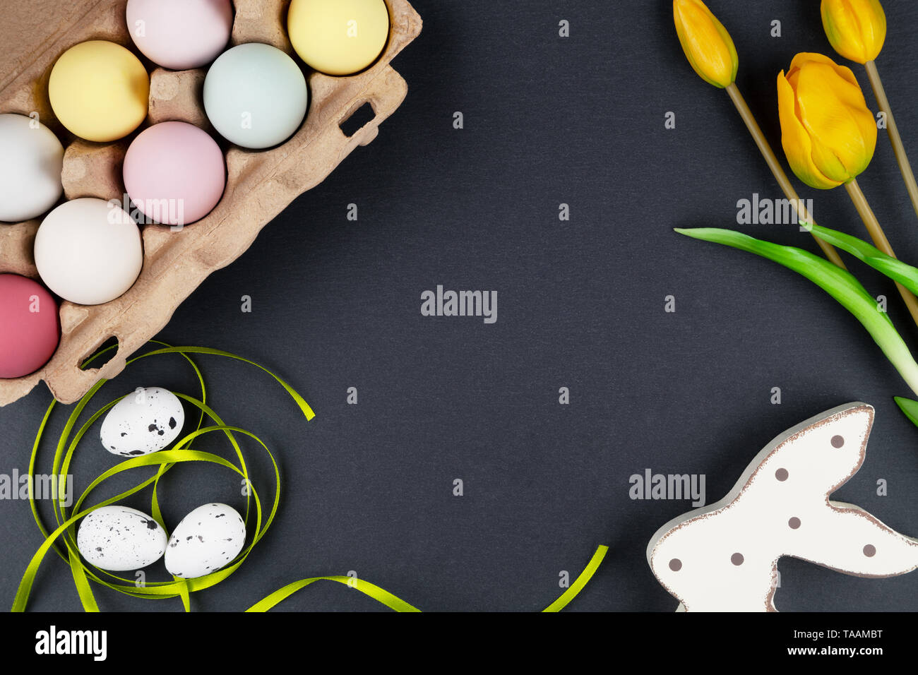 Easter background with easter eggs, easter bunny and flowers Stock Photo
