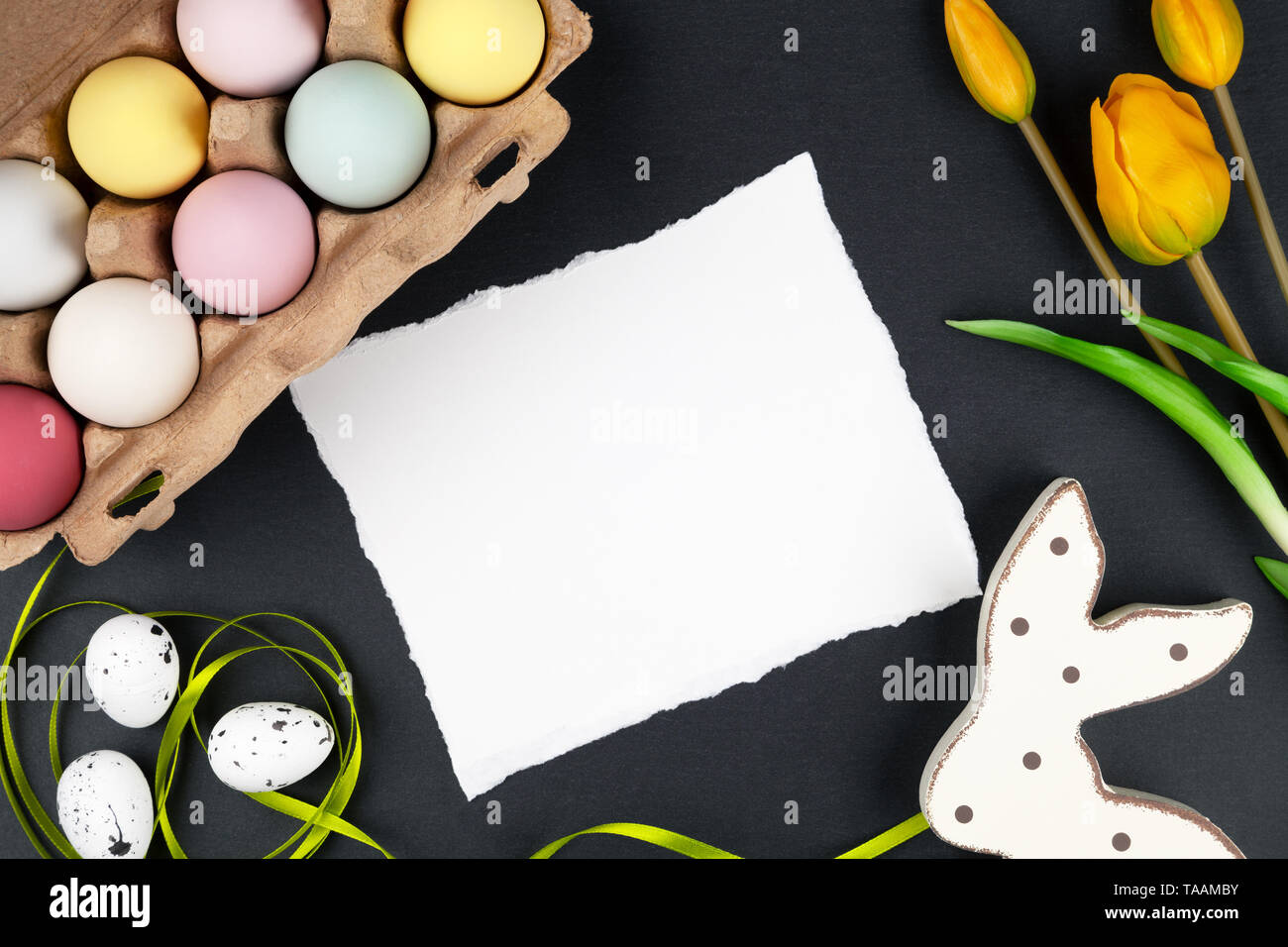 Easter background with easter eggs, easter bunny and flowers Stock Photo
