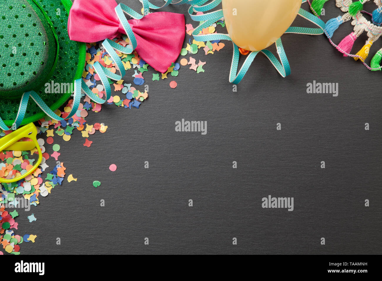 Carnival party background with confetti and costume accessories Stock Photo