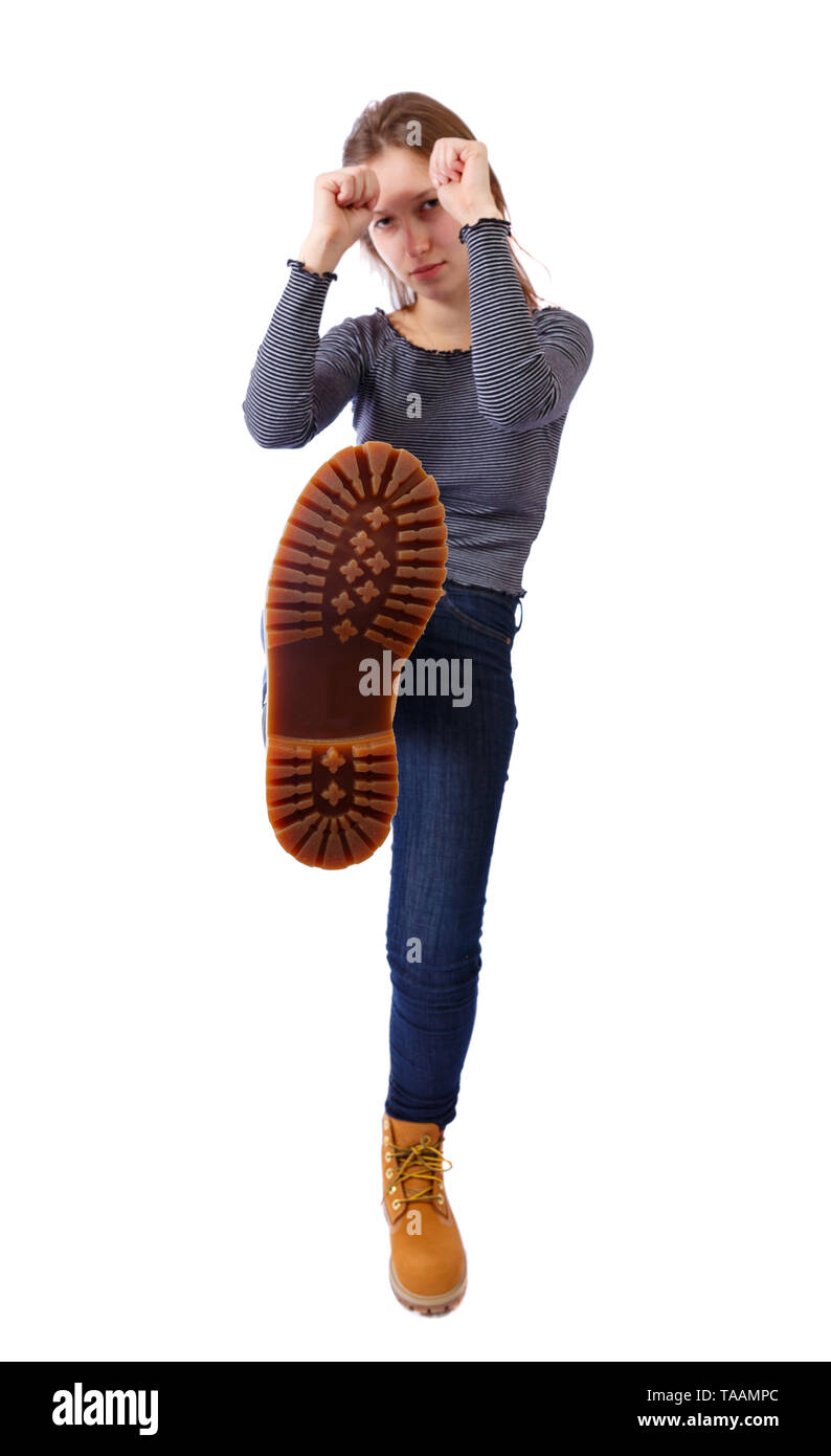 The woman is kicking. Foot with a shoe closeup. Corrugated sole of the