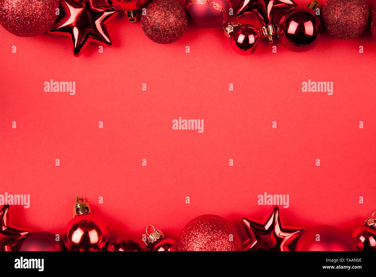 https://c8.alamy.com/comp/TAAN0E/christmas-background-red-glittering-christmas-baubles-lying-on-a-red-background-TAAN0E.jpg