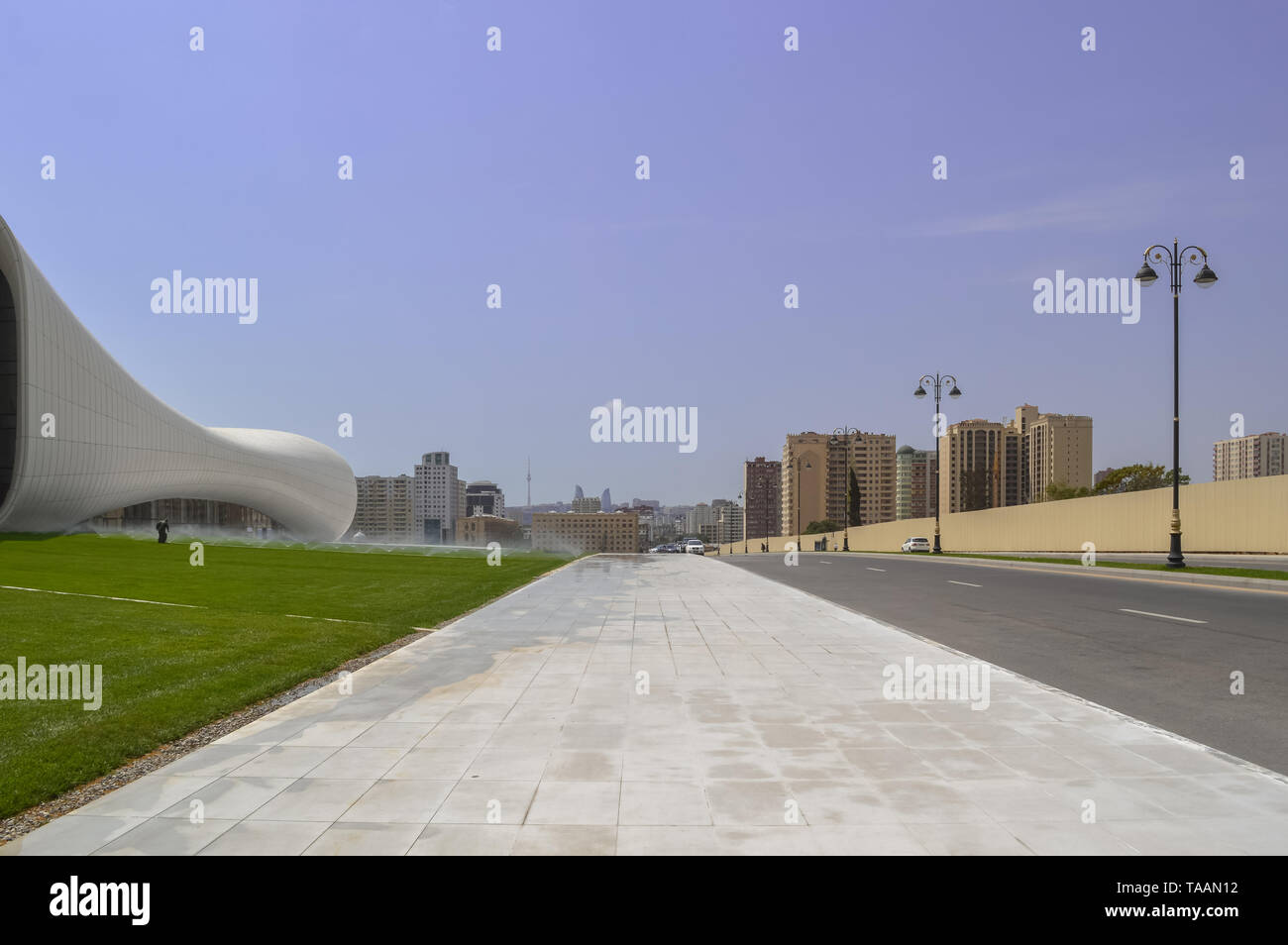 Baku, Azerbaijan, September 02, 2013: part of Heydar Aliyev centre with Baku cityscape Stock Photo