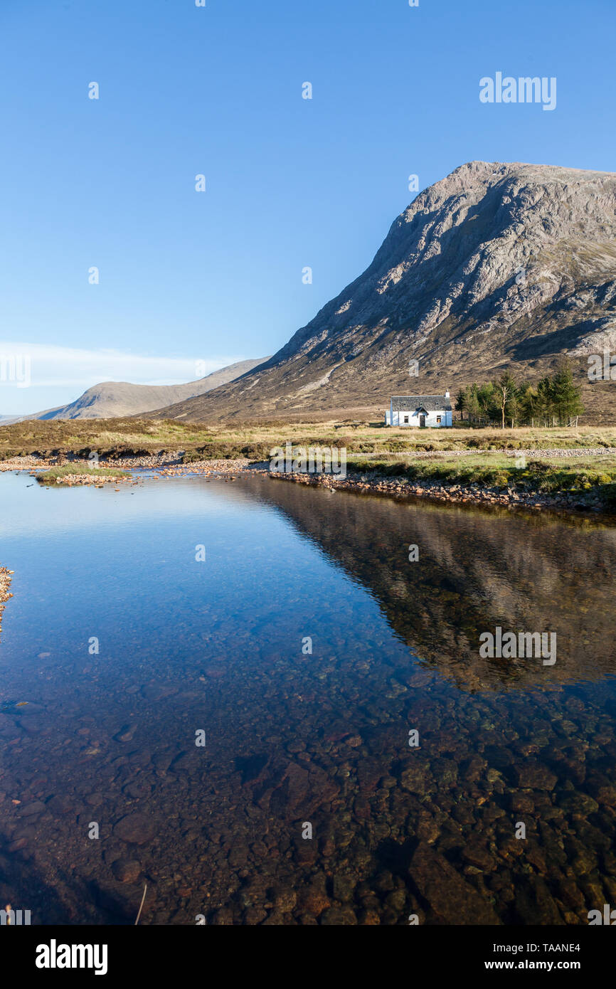 Cottage With Reflection In The Shadow Of A Hill In Early Evening Glen Coe Scotland Stock Photo Alamy