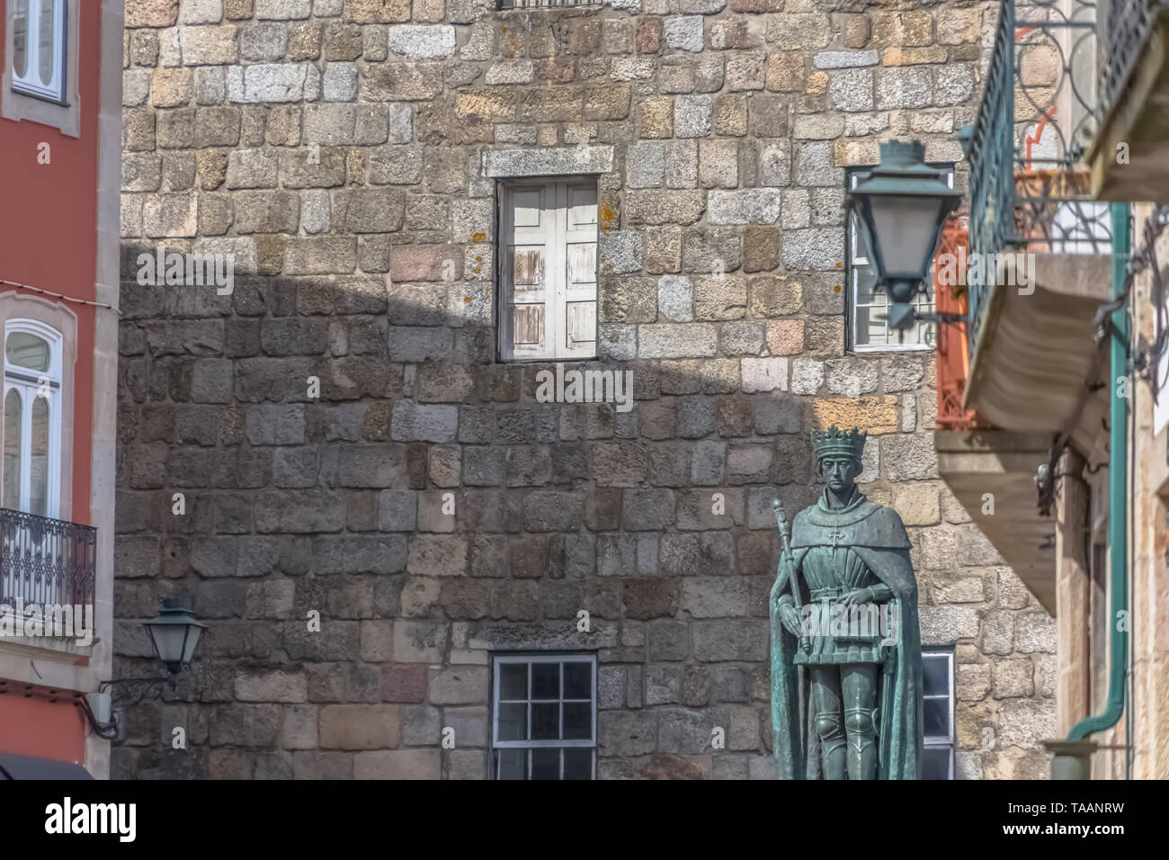 Viseu / Portugal - 04 16 2019 : Detailed view at the lateral facade of the Cathedral of Viseu, Sé Cathedral de Viseu, D. Duarte statue, architectural  Stock Photo