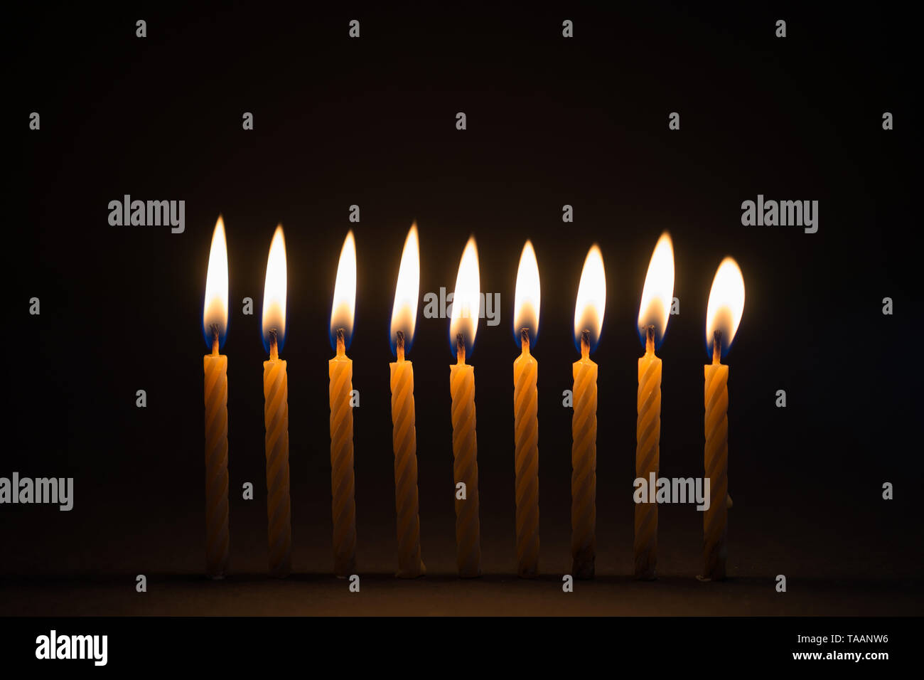 Burning birthday candles with black background Stock Photo Alamy