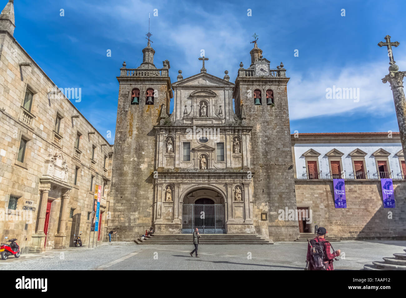 Viseu / Portugal - 04 16 2019 : View at the front facade of the Cathedral of Viseu, Adro da Sé Cathedral de Viseu, tourist people, architectural icon  Stock Photo