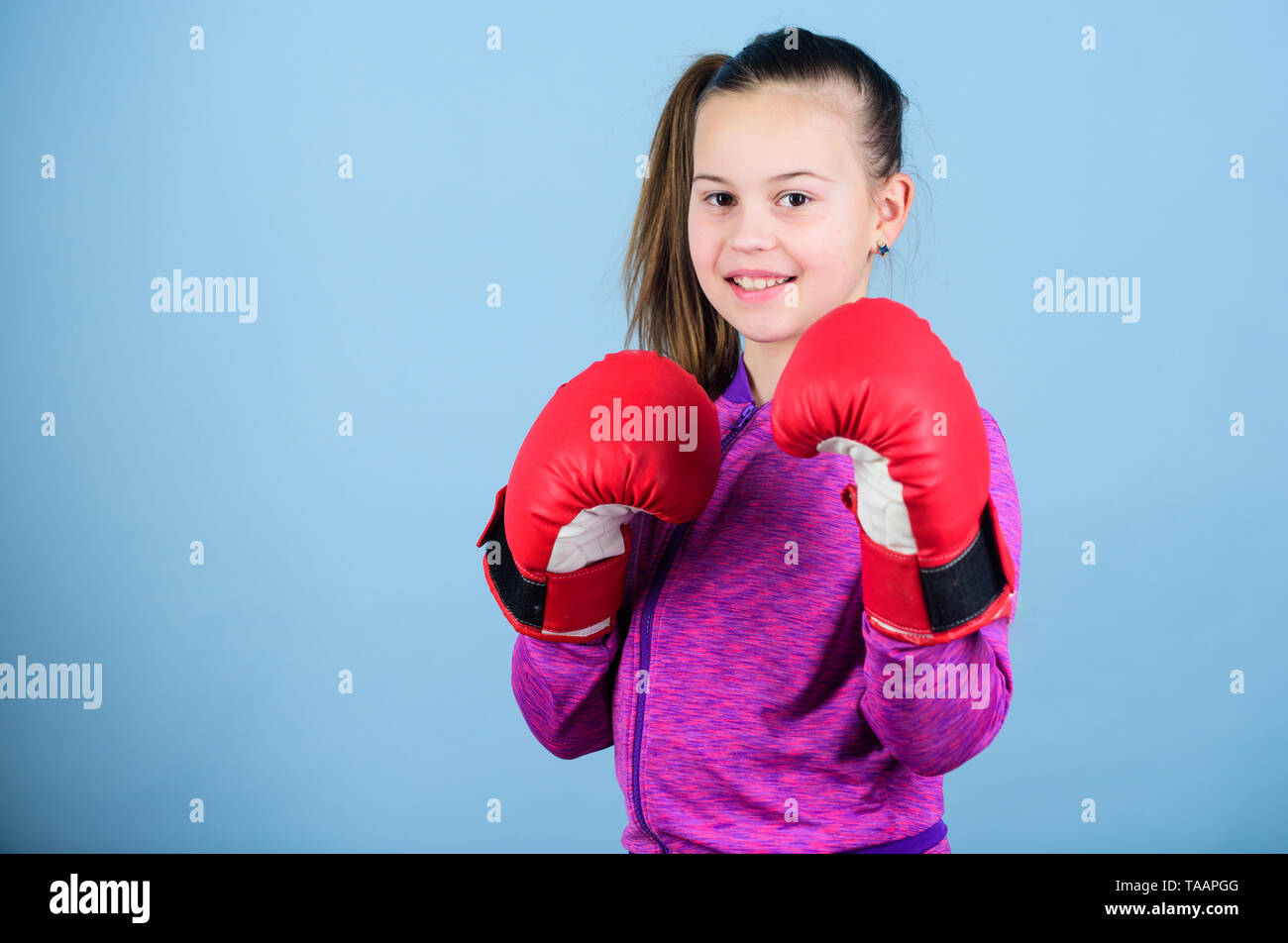 Rise of women boxers. Girl cute boxer on blue background. With great