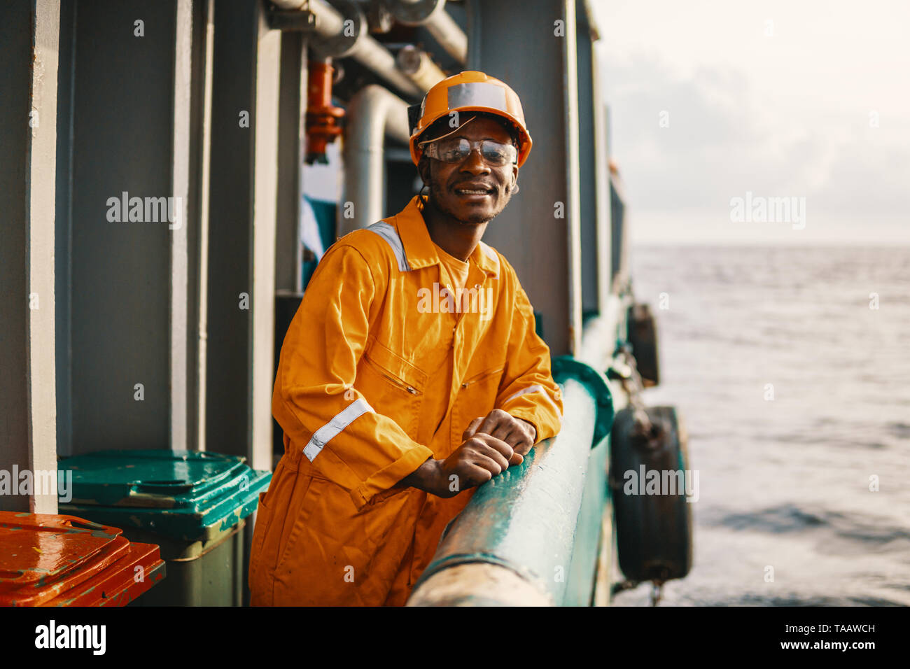 happy Seaman AB or Bosun on deck of vessel or ship Stock Photo