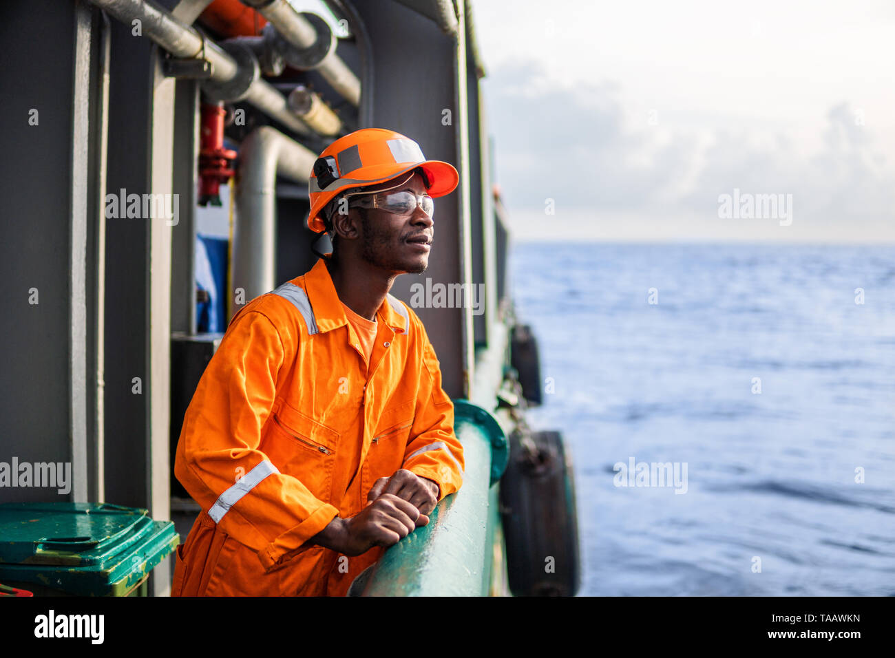 Tired Seaman AB or Bosun on deck of vessel or ship Stock Photo - Alamy