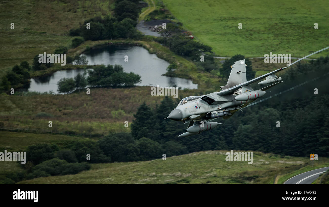 RAF Panavia Tornado GR4 flying low level through the Mach Loop in Wales, UK Stock Photo