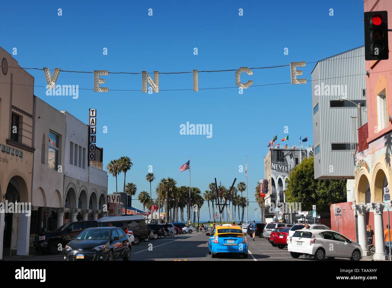VENICE, UNITED STATES - APRIL 6, 2014: People visit Venice Beach, California. Venice Beach is one of most popular beaches of LA County. 9.8 million pe Stock Photo