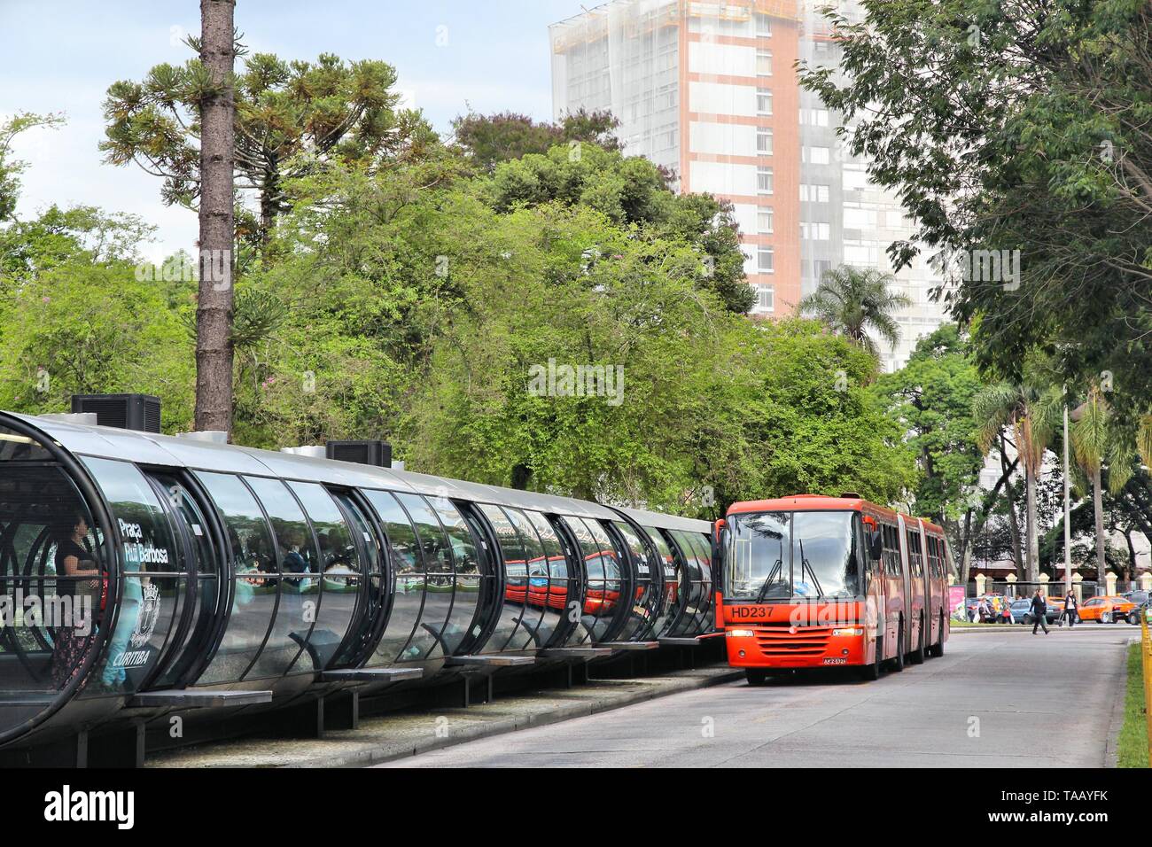 CURITIBA, BRAZIL - OCTOBER 7, 2014: People ride city bus in Curitiba, Brazil. Curitiba's bus system is world famous for its efficiency. Founded in 197 Stock Photo