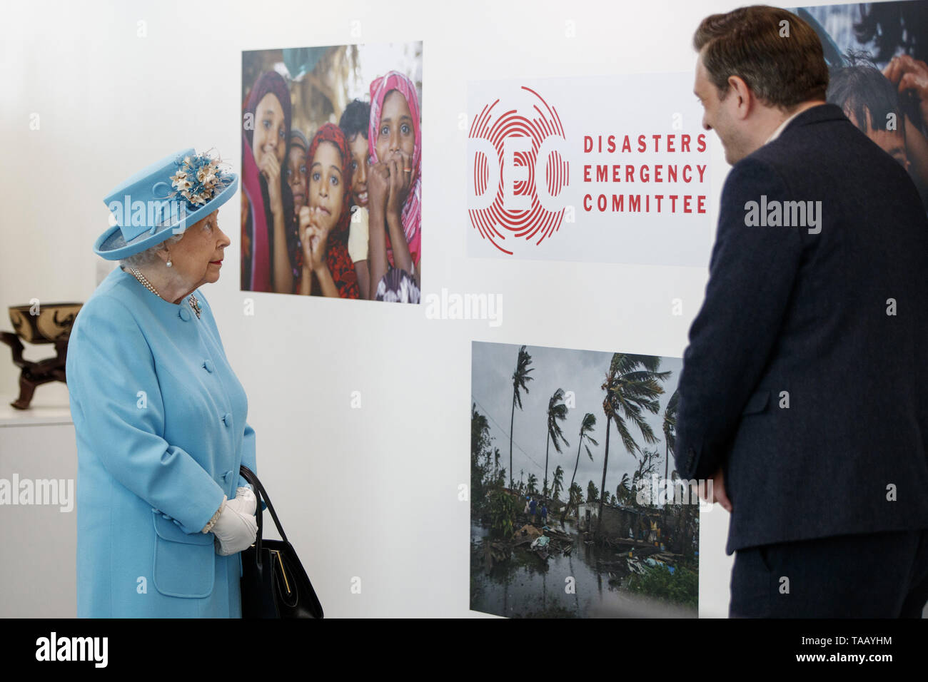 Queen Elizabeth II meets an employee involved in the community