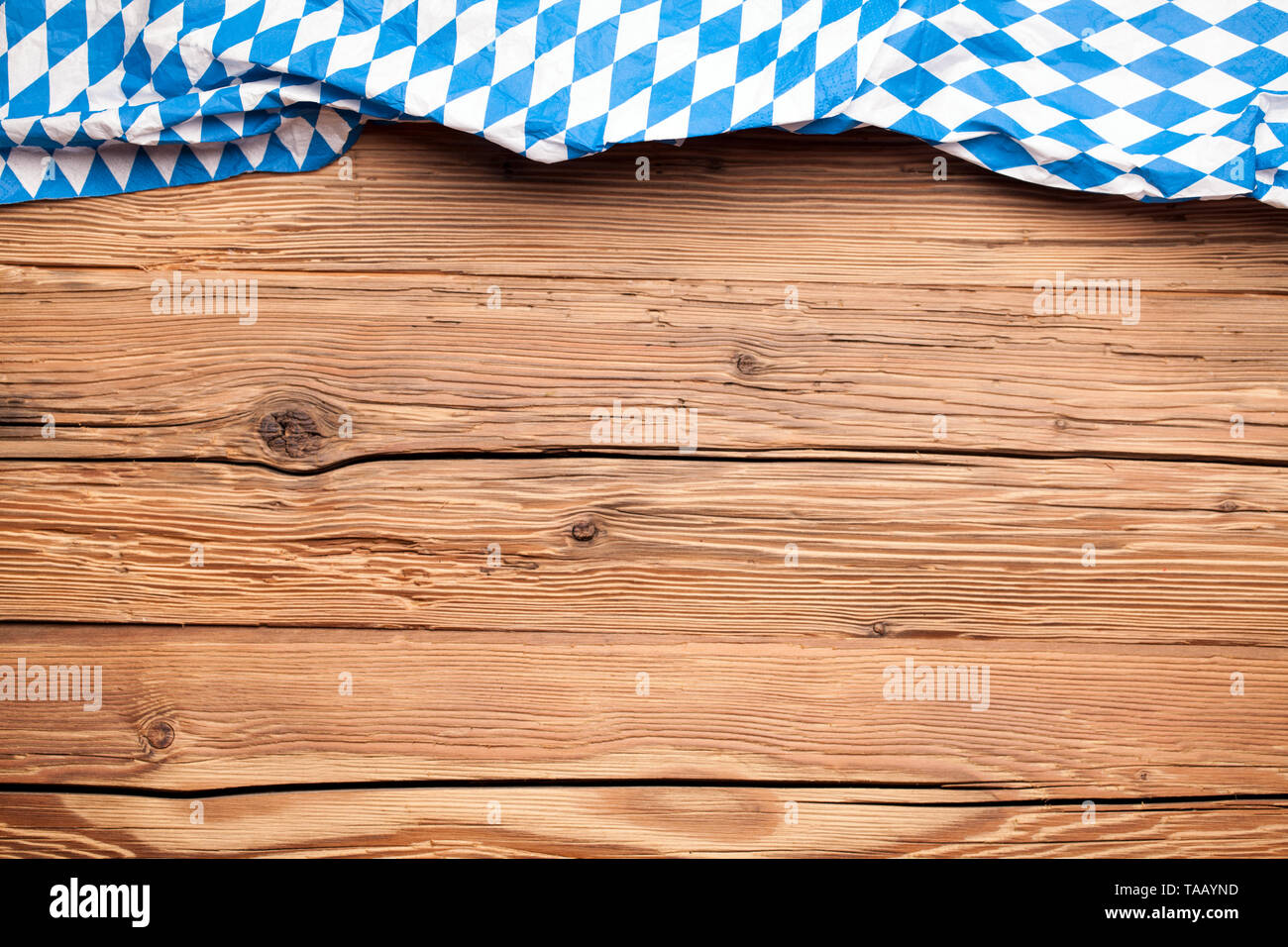Oktoberfest tablecloth on an old rustic wooden background Stock Photo
