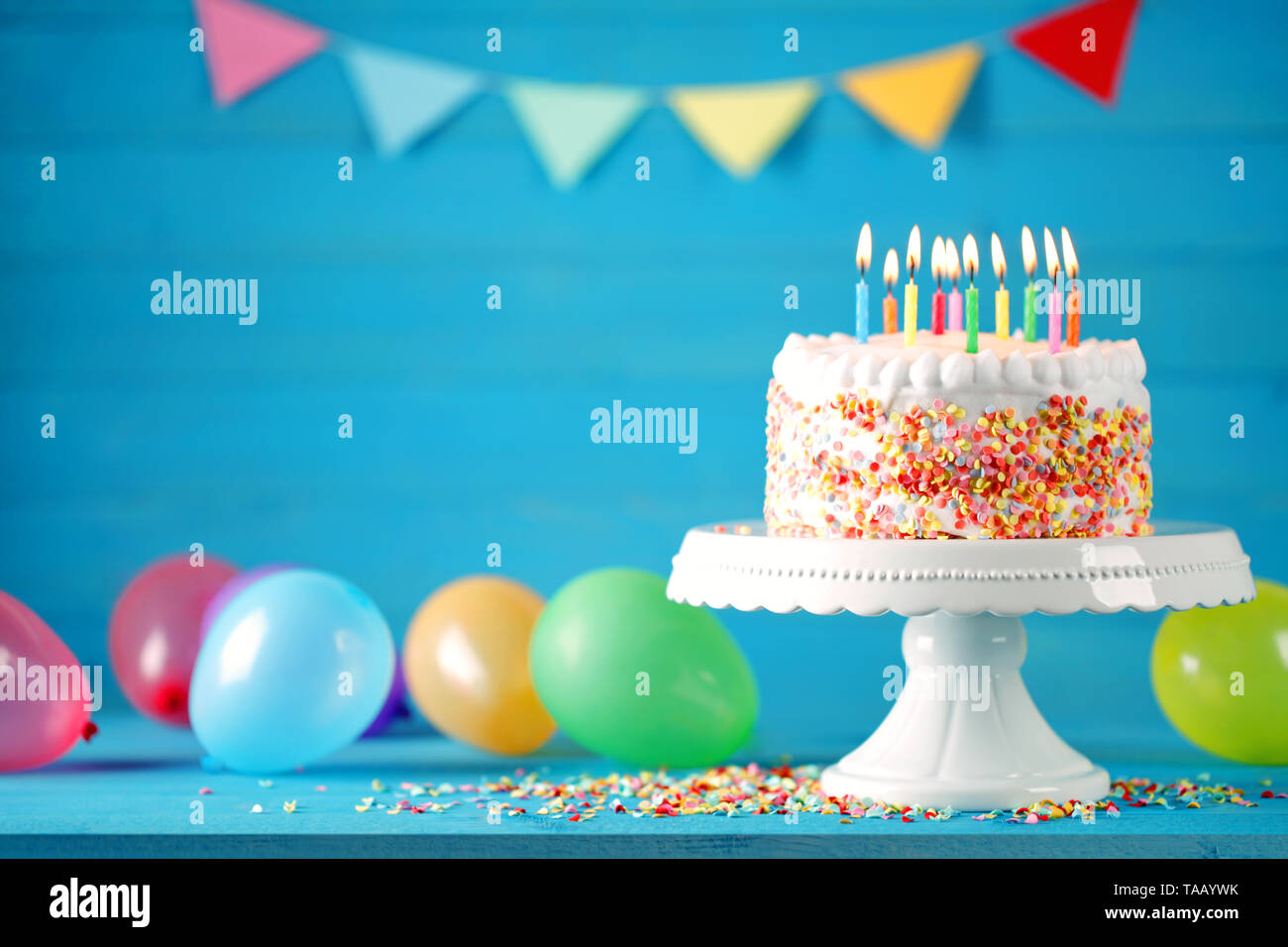 Happy birthday cake with colorful balloons decoration. Birthday card. Stock Photo